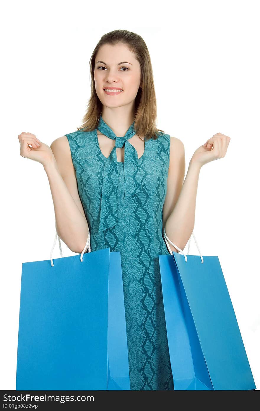 Beautiful girl with shopping bags. Isolated on white