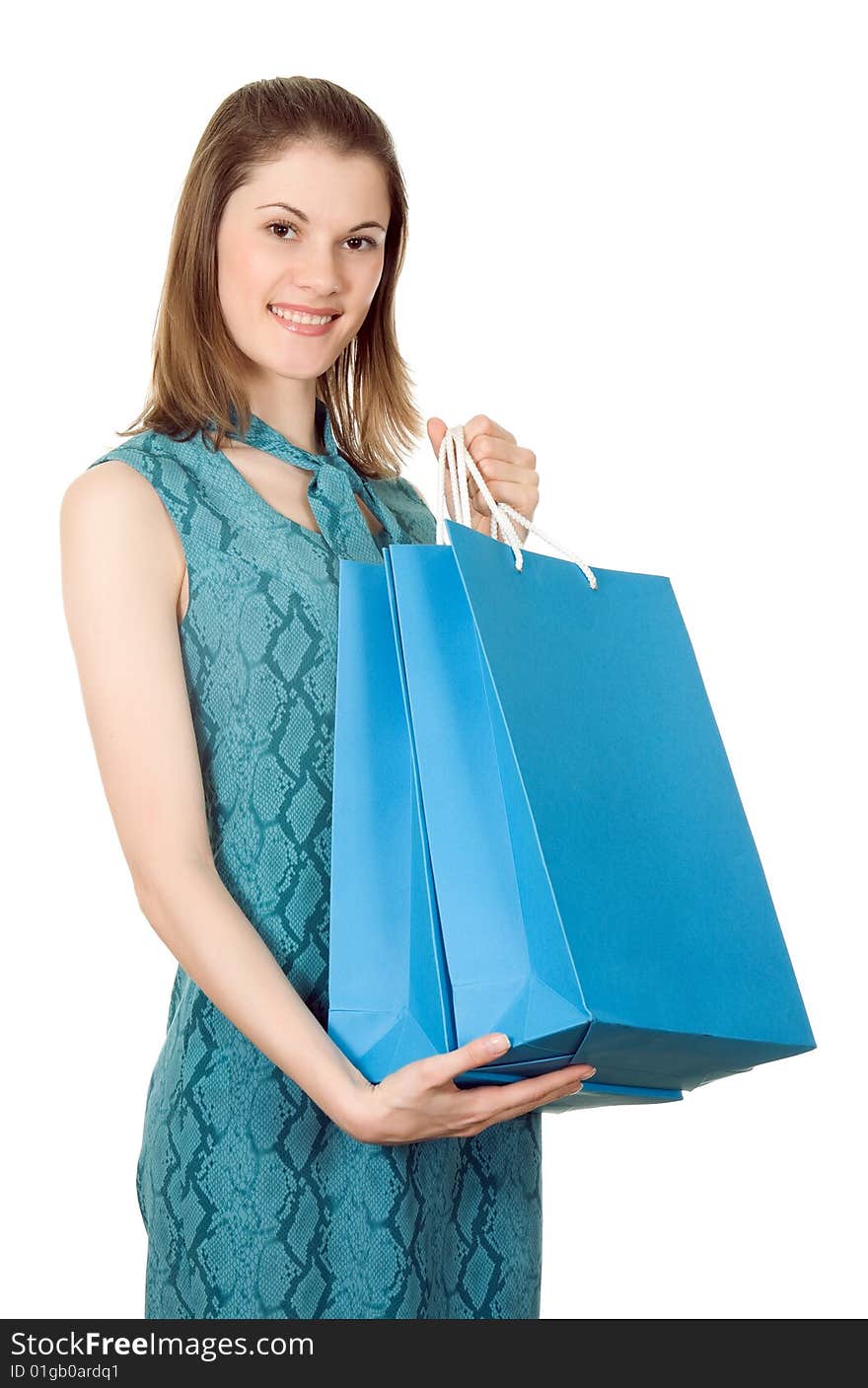 Beautiful girl with shopping bags. Isolated on white