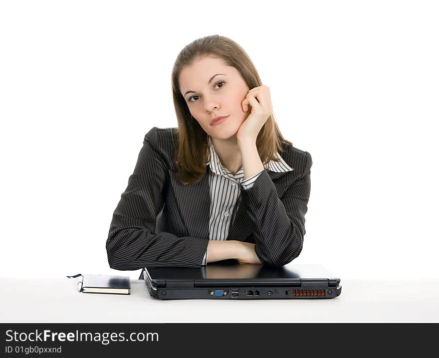 Beautiful young businesswoman with a laptop. Isolated on white.