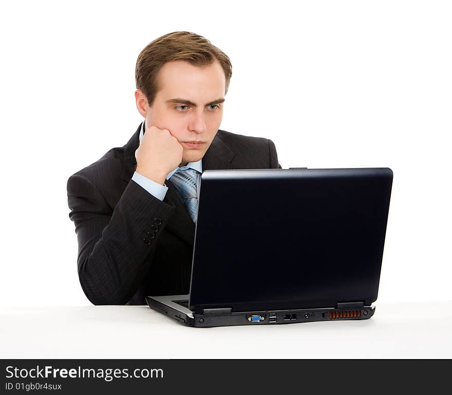 Businessman working on laptop. Isolated on white.