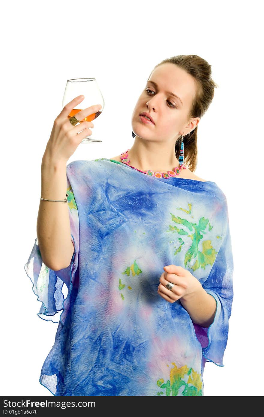 Woman with a glass of cognac. Isolated on white.