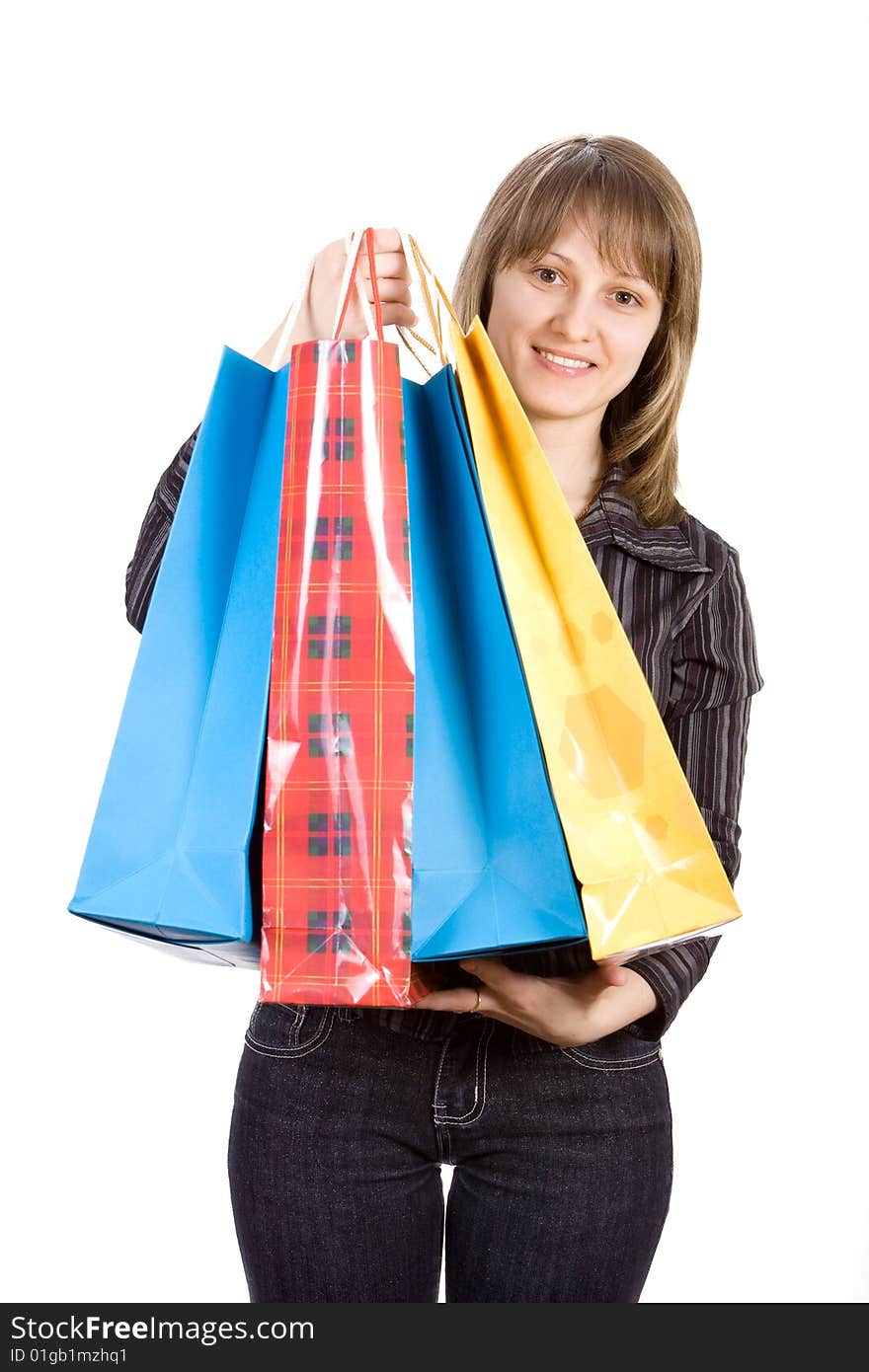 Beautiful girl with shopping bags. Isolated on white