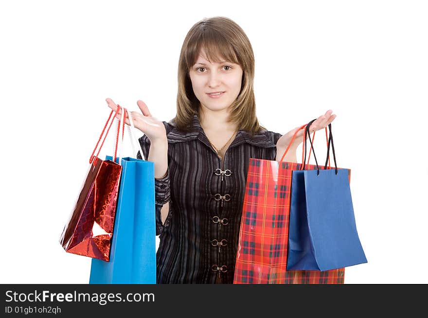 Beautiful girl with shopping bags. Isolated on white