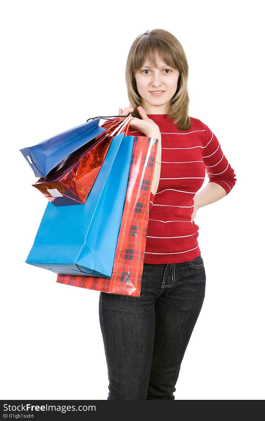 Beautiful girl with shopping bags. Isolated on white