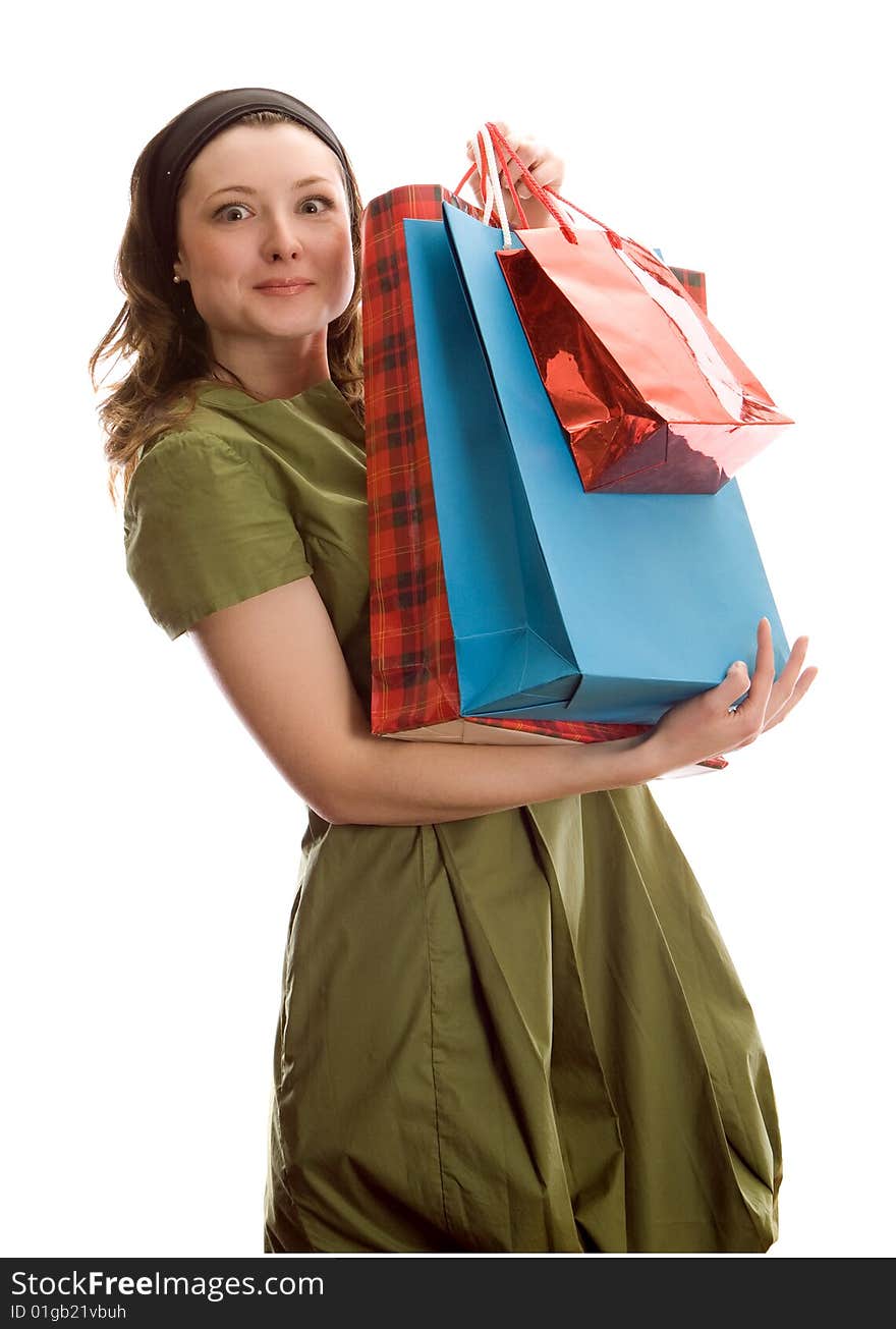 Beautiful girl with shopping bags. Isolated on white