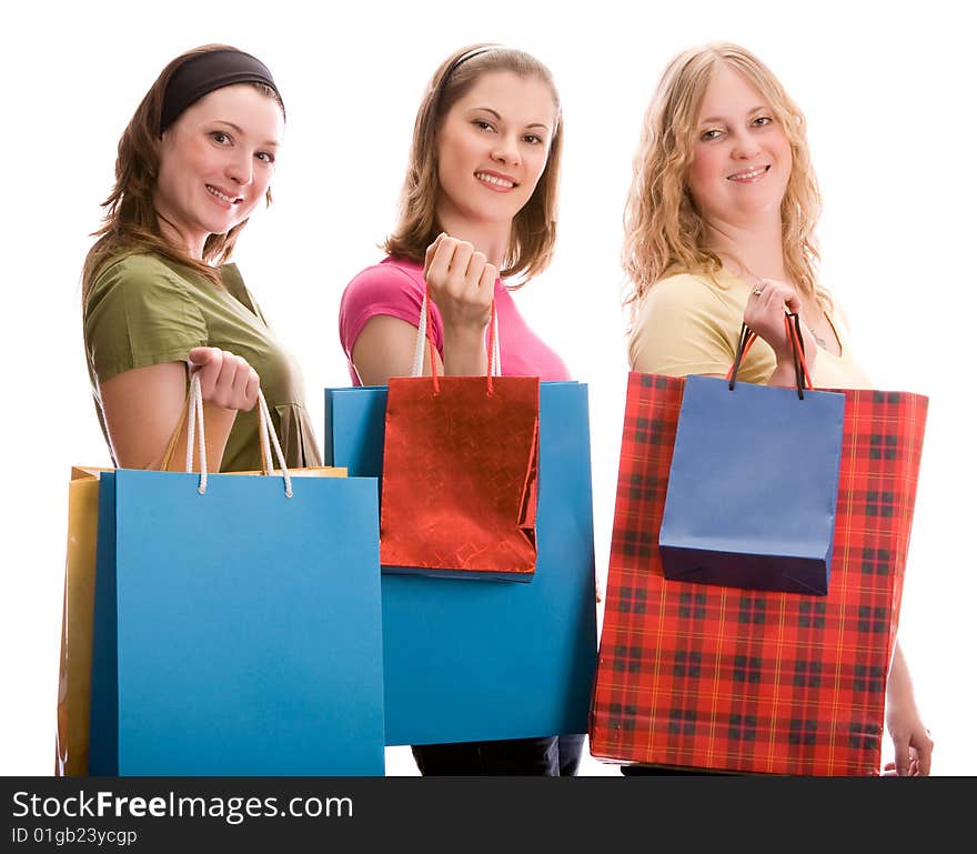 Three Girls With Shopping Bags. Isolated On White