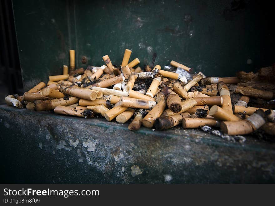 Selective focus of Large number of cigarette butts, close-up. Selective focus of Large number of cigarette butts, close-up.