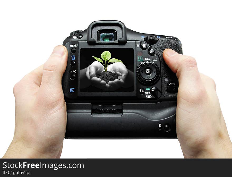 Black digital camera in hands