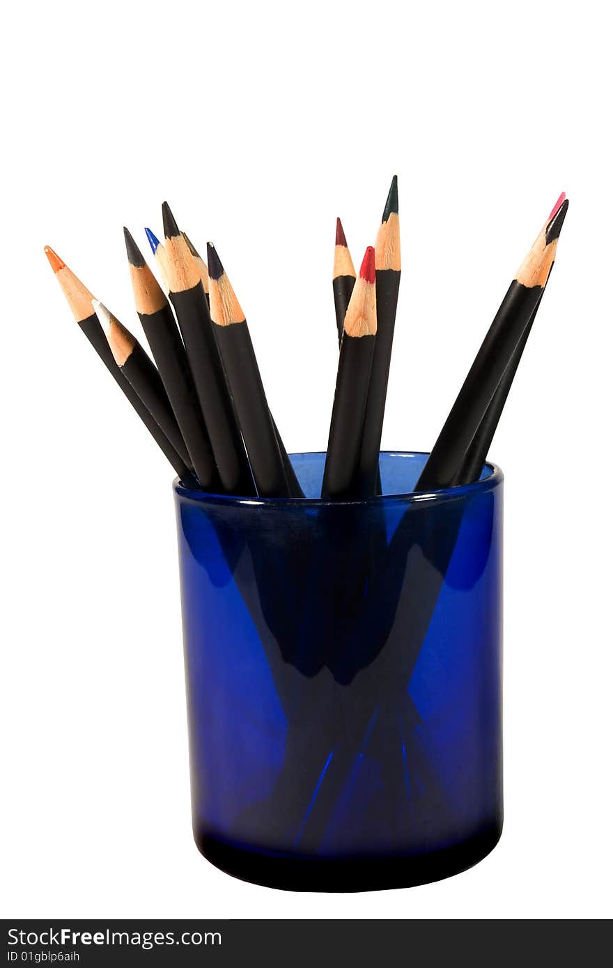 Bunch of color pencils in a blue glass (isolated on white). Bunch of color pencils in a blue glass (isolated on white)