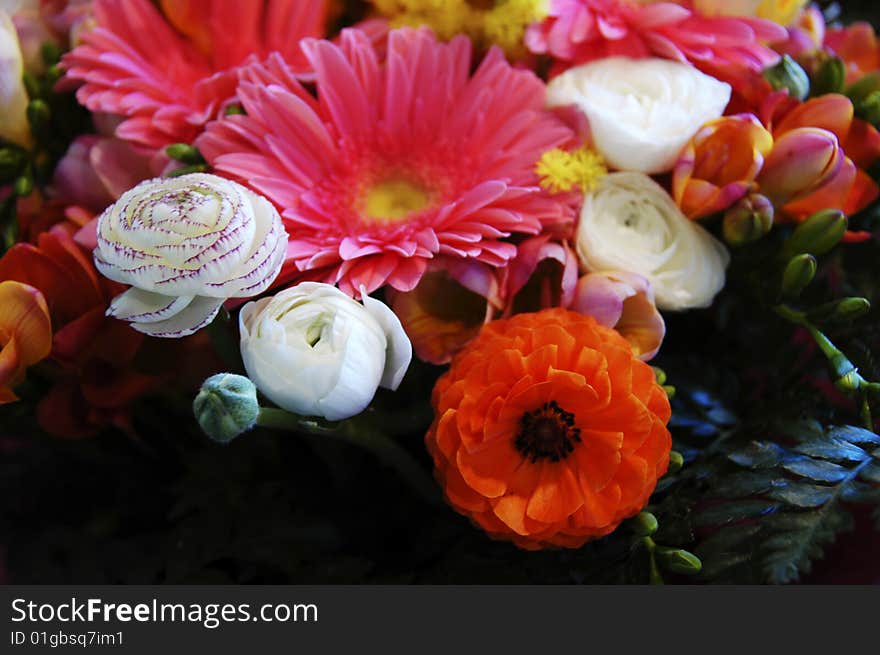 Heap of colored flowers as background