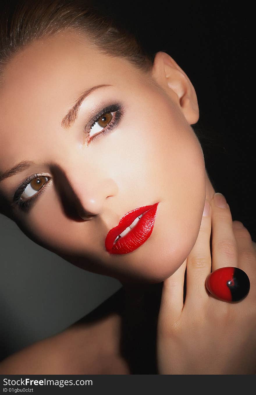 Girl with very beautiful evening make-up, red, bright lipstick. Glamour lady, studio shot. Girl with very beautiful evening make-up, red, bright lipstick. Glamour lady, studio shot