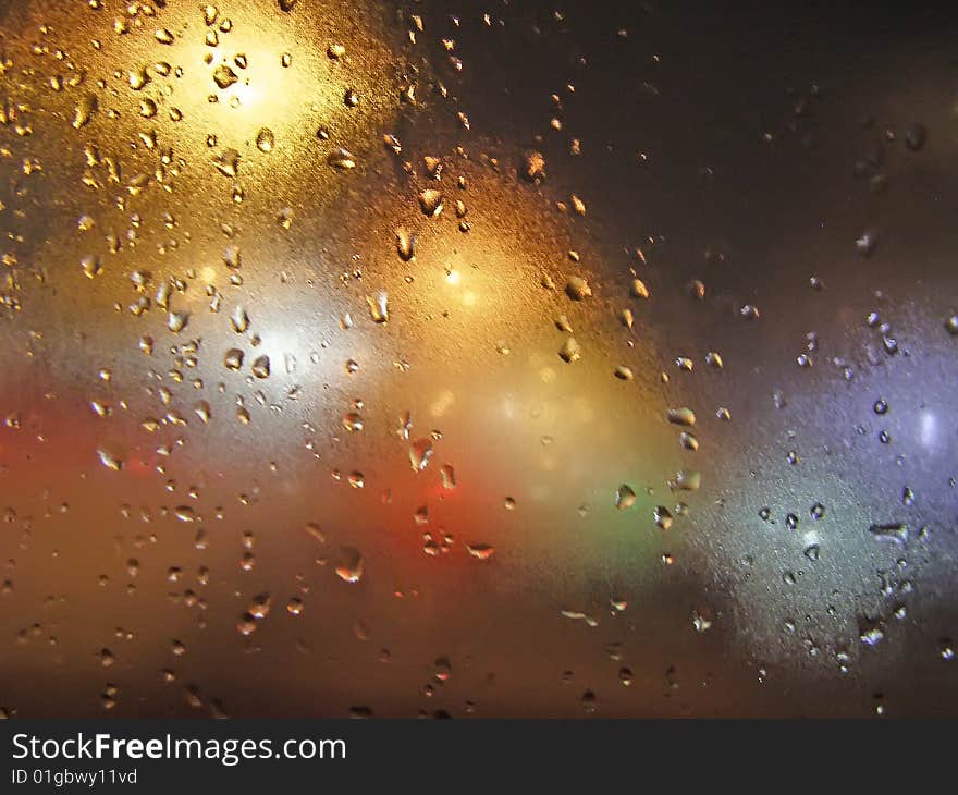 Abstract background with water drops and night lights