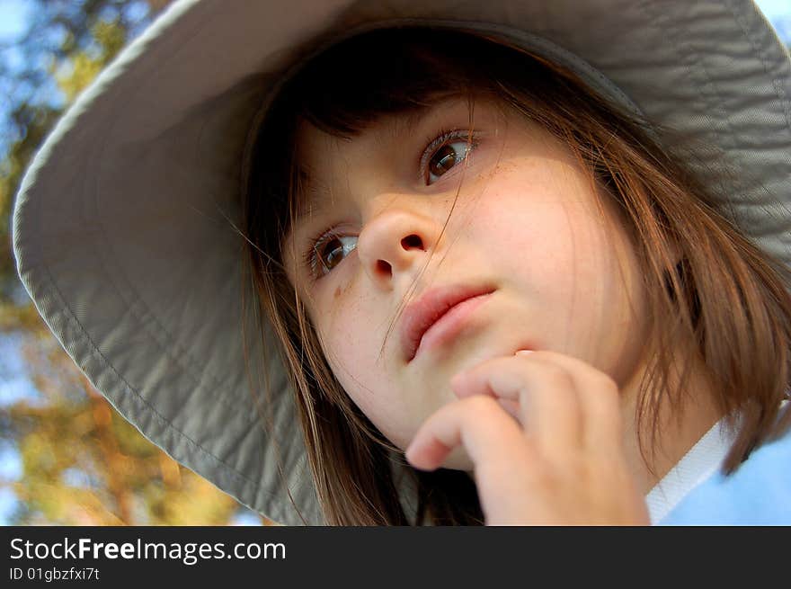 Portrait of girl in hat with wide brim