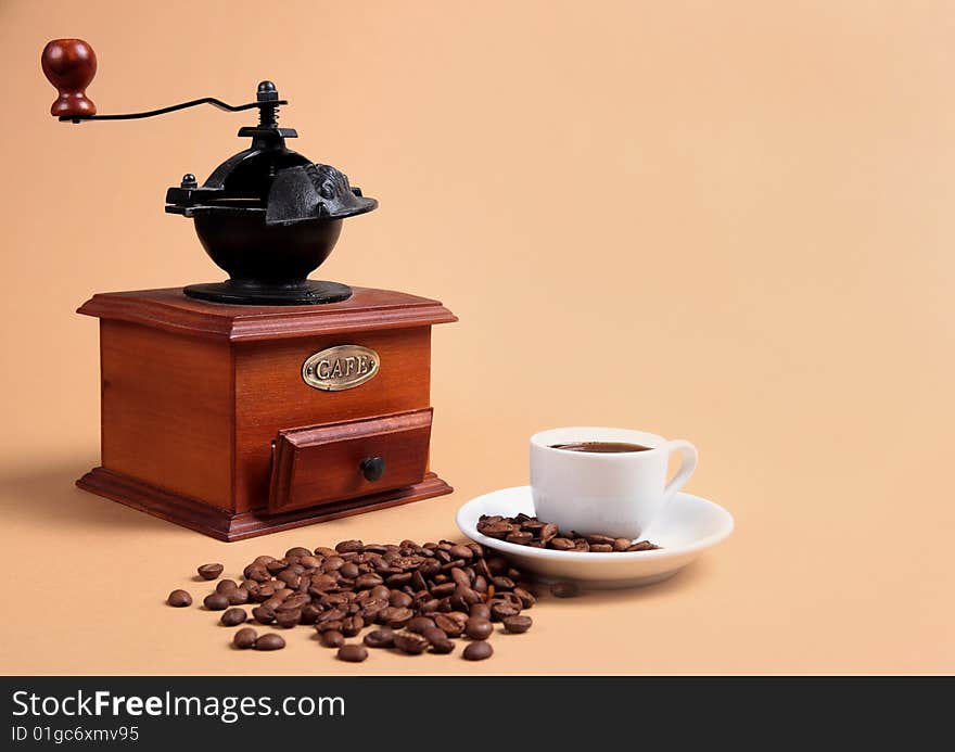 Coffee grinder, coffee beans and cup with fragrant coffee. Coffee grinder, coffee beans and cup with fragrant coffee