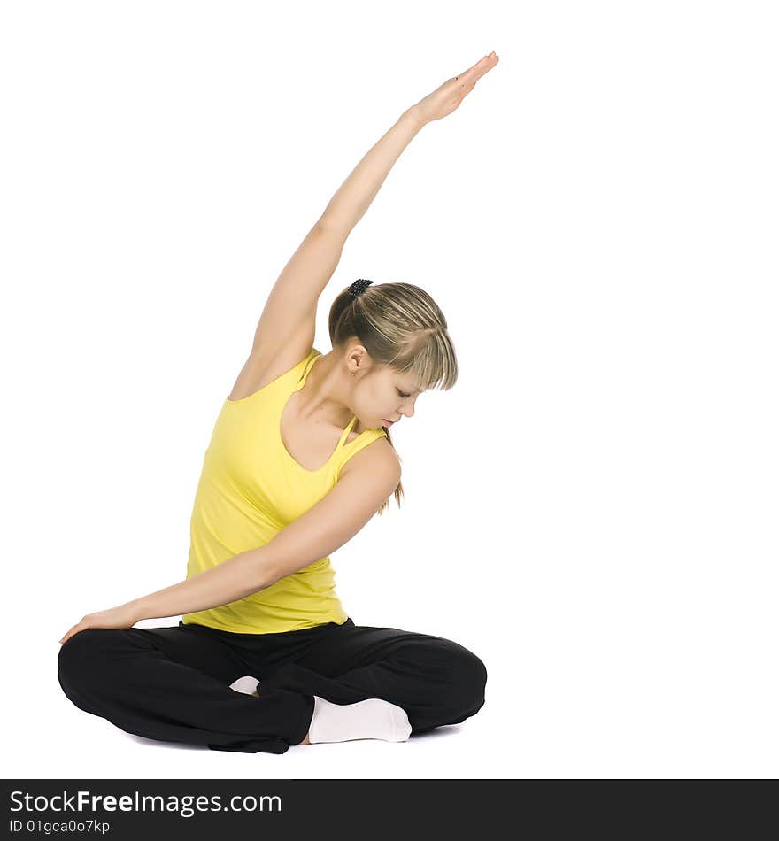 Fitness girl stretching. Isolated on white