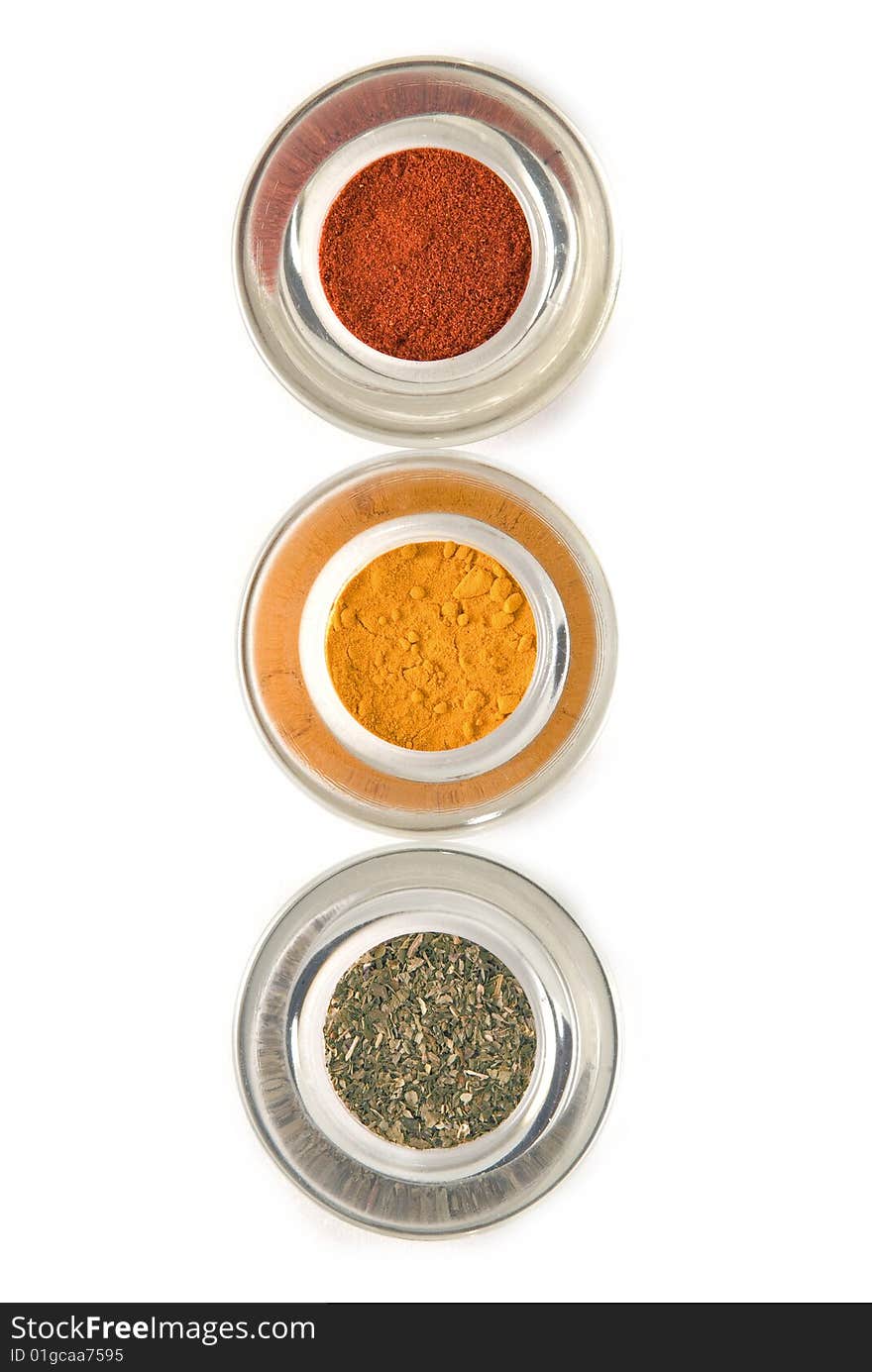 Red yellow and green spices lined up isolated. Red yellow and green spices lined up isolated