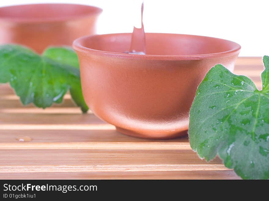 Tea tree oil for the skin care on a white background