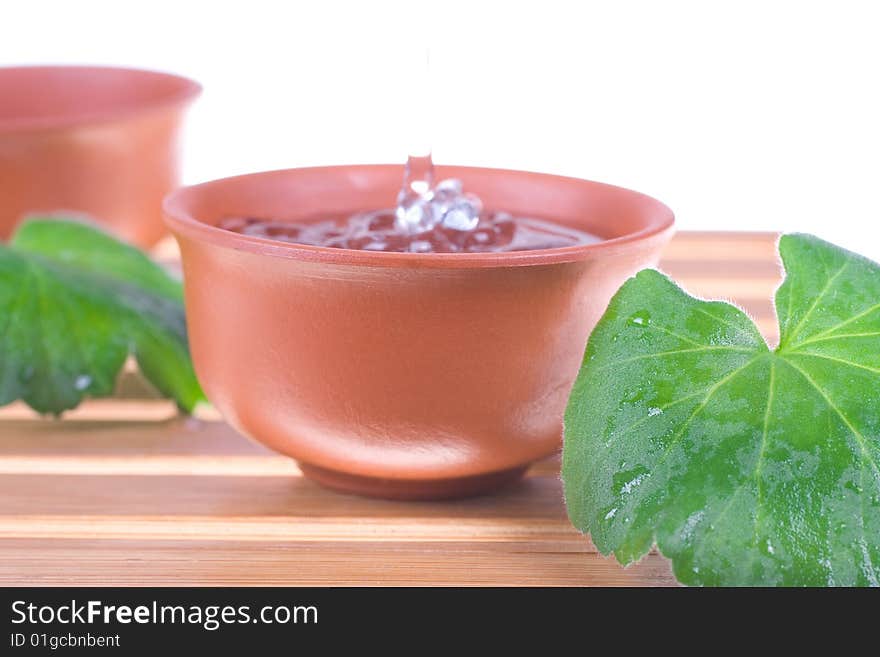 Tea tree oil for the skin care on a white background