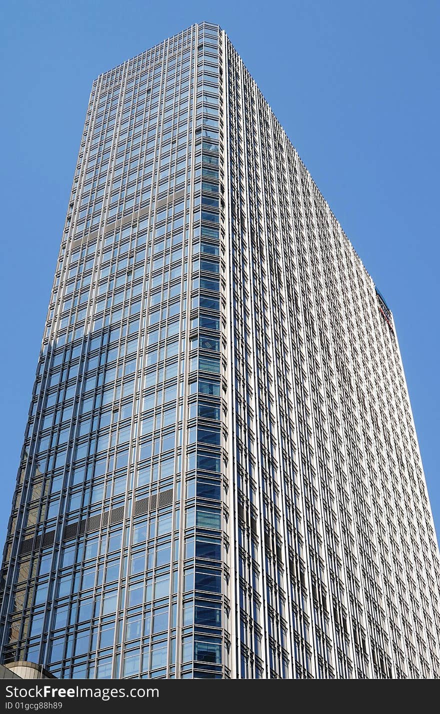 Modern office building against blue sky