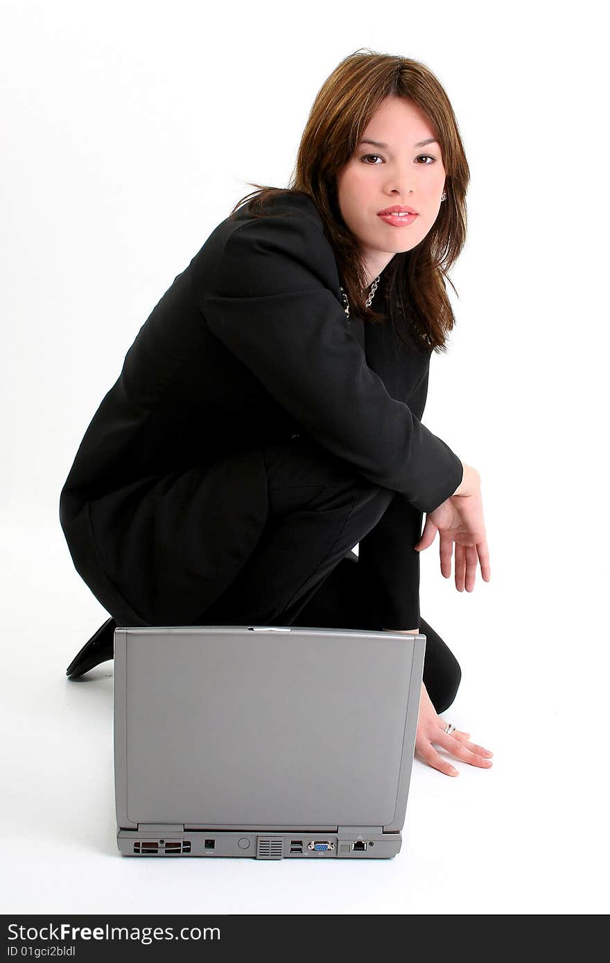 Beautiful 18 year old hispanic woman full body in suit with laptop. Beautiful 18 year old hispanic woman full body in suit with laptop.