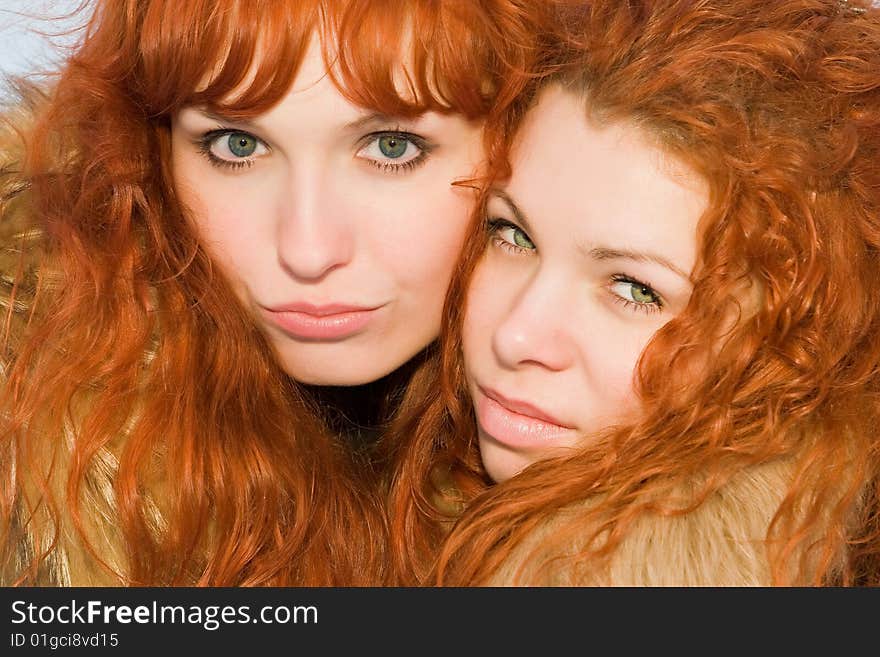 Two beautiful red hair girls closeup. Two beautiful red hair girls closeup