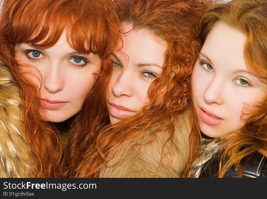 Three beautiful red hair girls closeup. Three beautiful red hair girls closeup