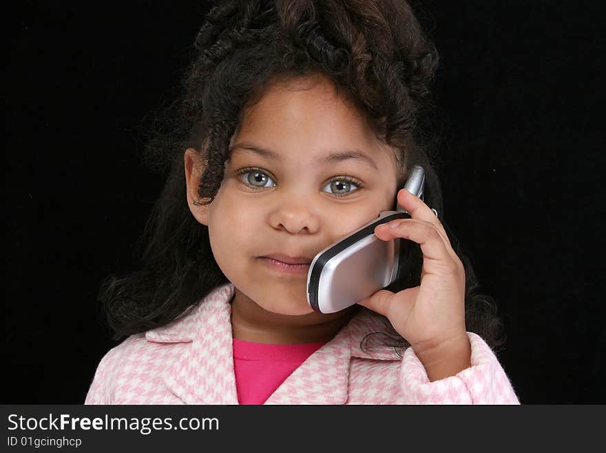 Adorable five year old business woman on cellphone. Adorable five year old business woman on cellphone.