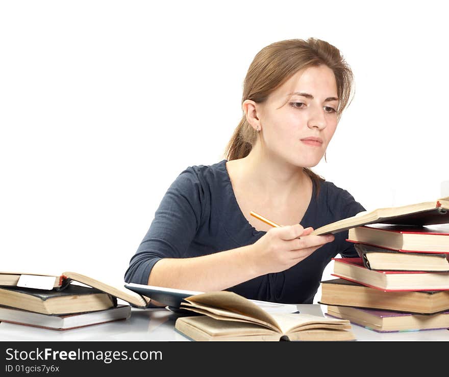 Young woman and a pile of books