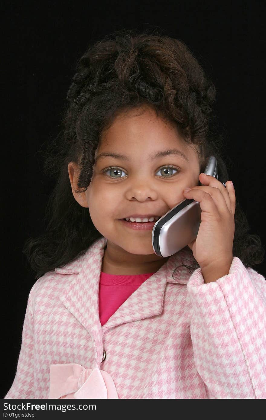 Adorable five year old business woman on cellphone. Adorable five year old business woman on cellphone.