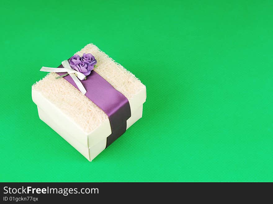 A gift box on green background