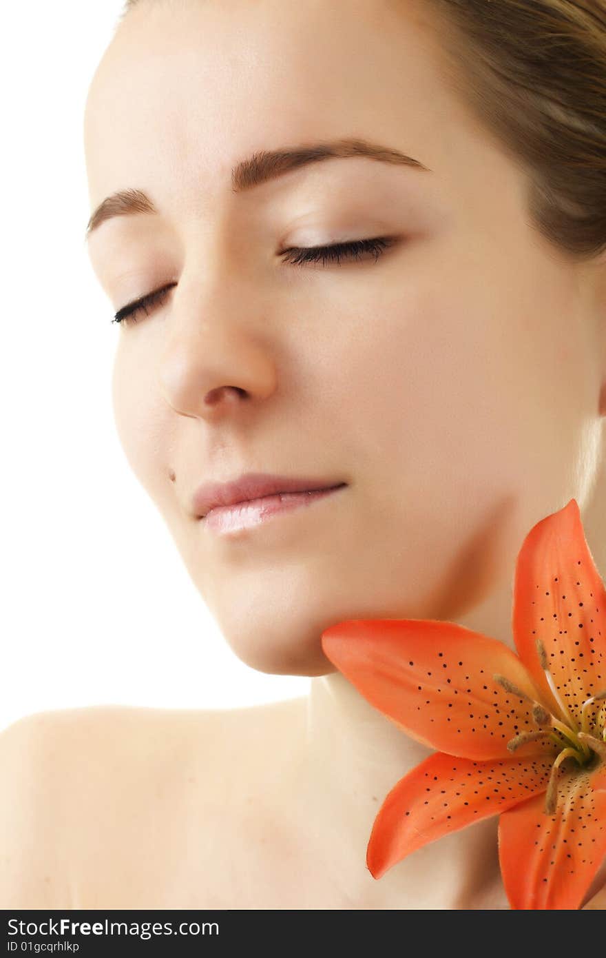 Portrait  beautiful woman with flower isolated on white