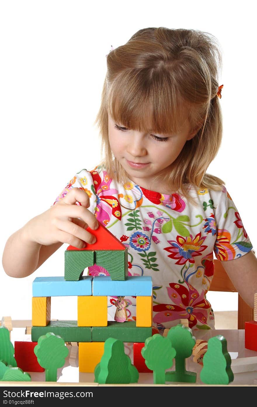 Little girl playing with cubes