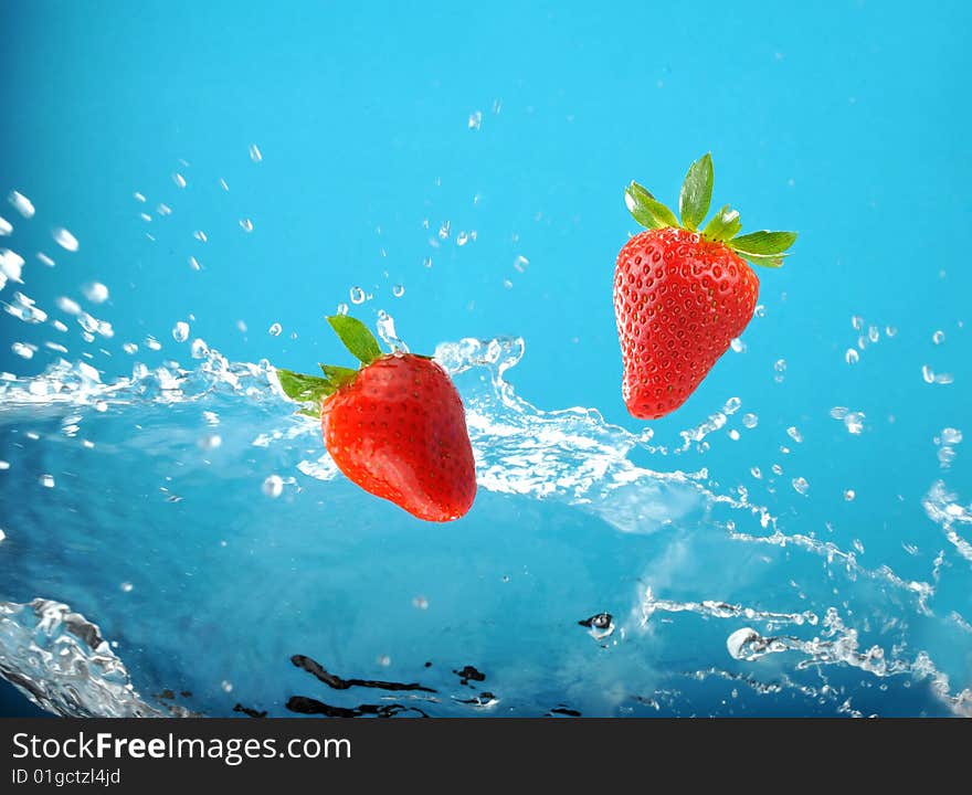 Fresh colored splash with strawberrys