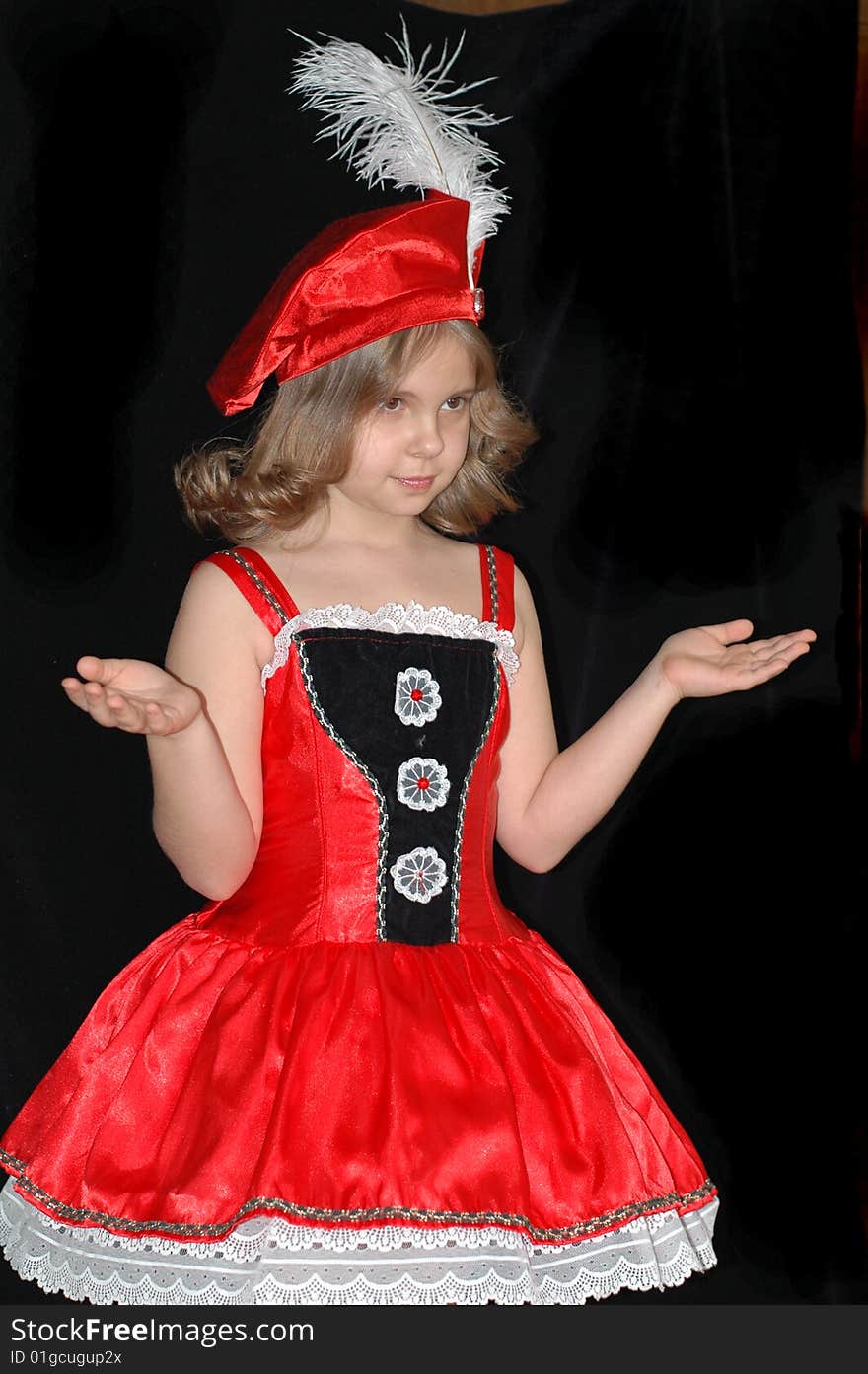 Little girl in red dress and hat