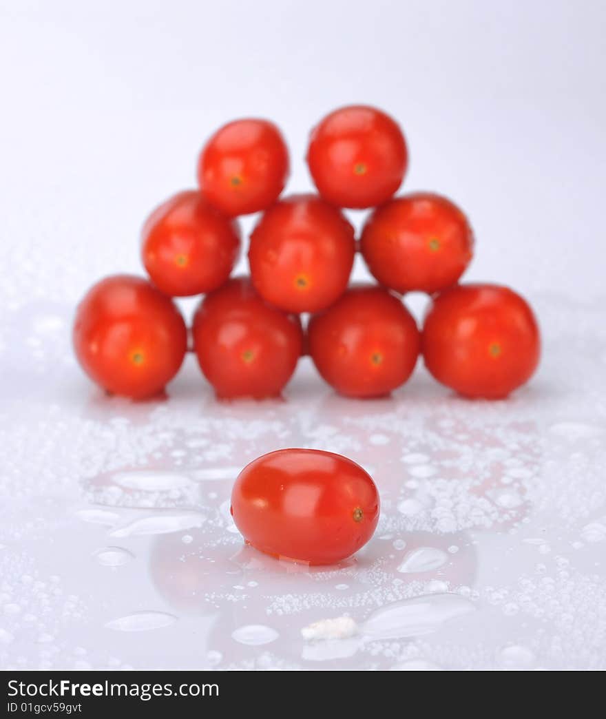 Small tomatoes in a white background