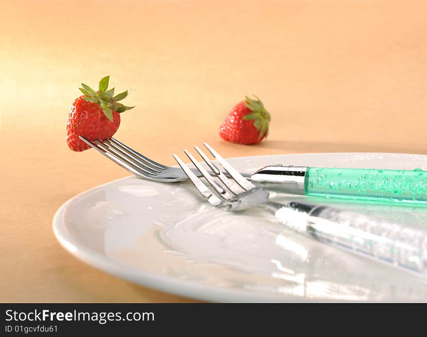 Orange background fork strawberry Dishes. Orange background fork strawberry Dishes