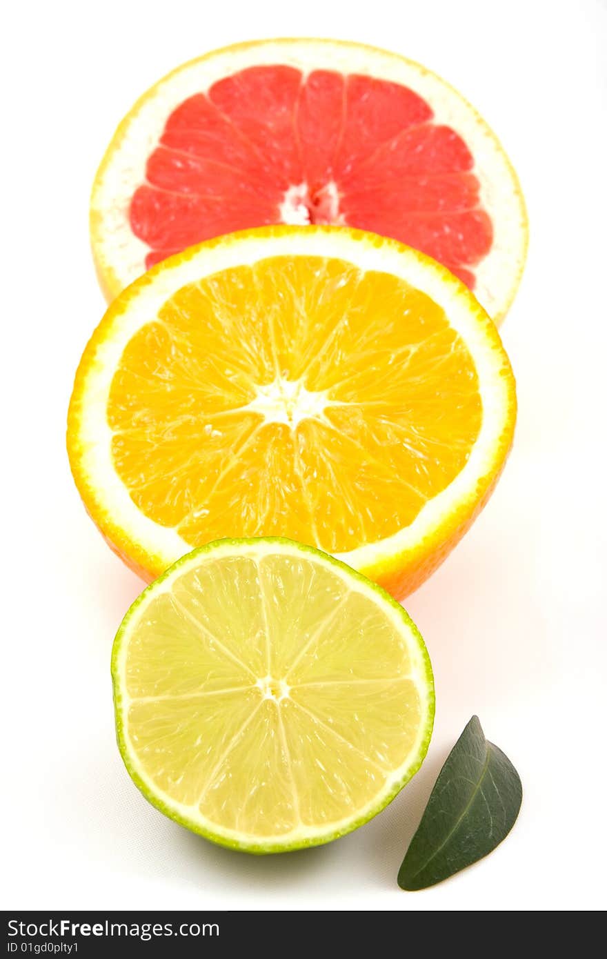 Lime, orange , grapefruit and green leaf. Lime, orange , grapefruit and green leaf