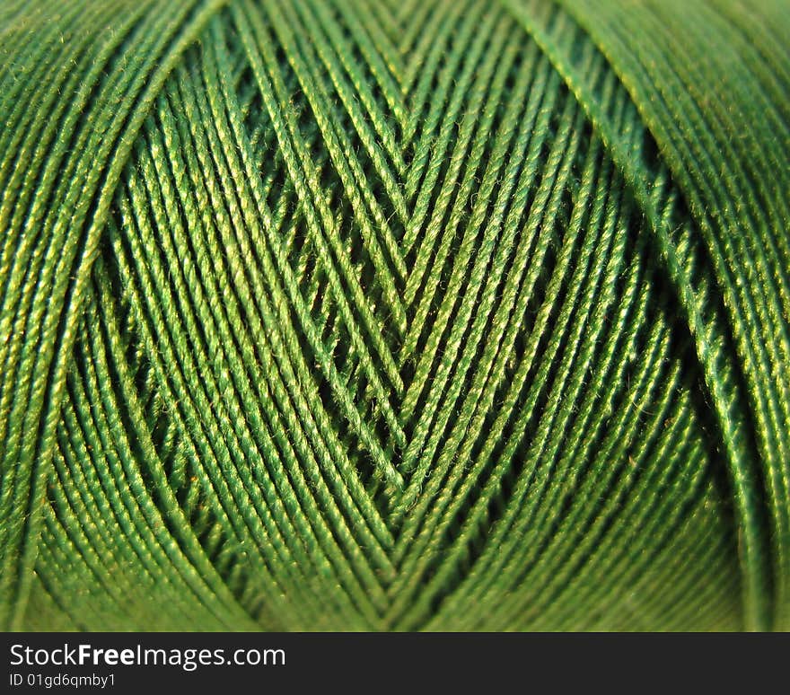 A close up of a green spool good for texture