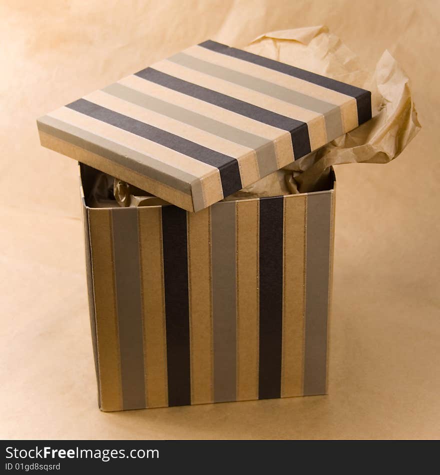 Open gift box with craft paper inside