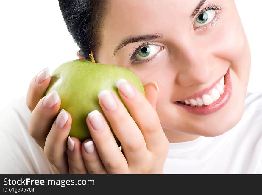 Beautiful young woman holding an apple