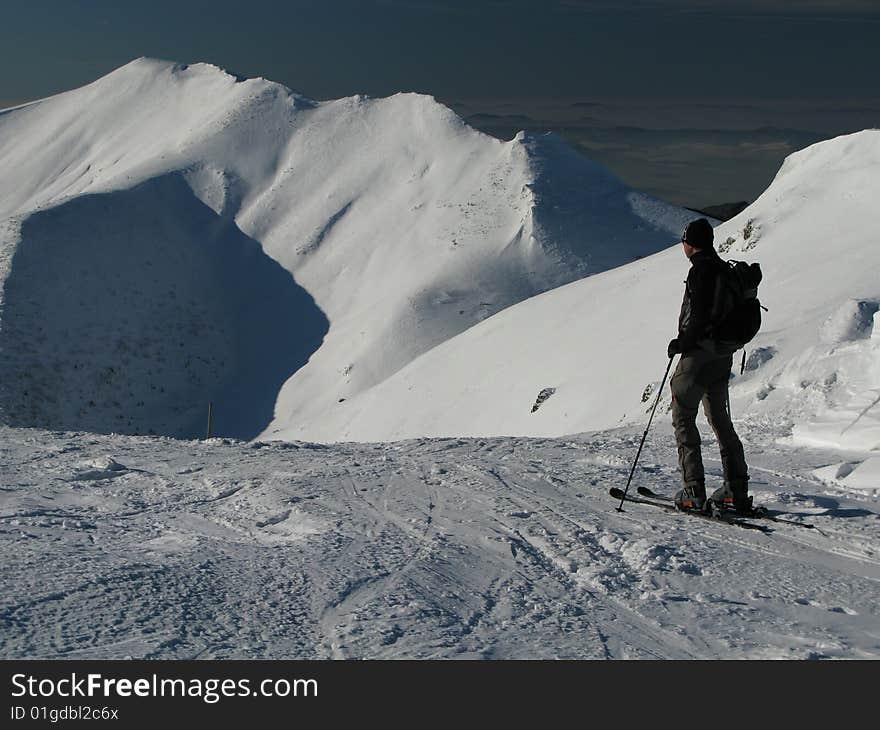 Skier on snowy high mountains. Skier on snowy high mountains