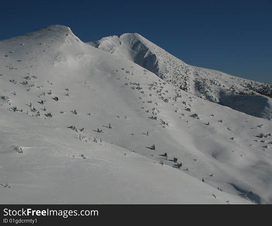 Winter season on snowy mountains