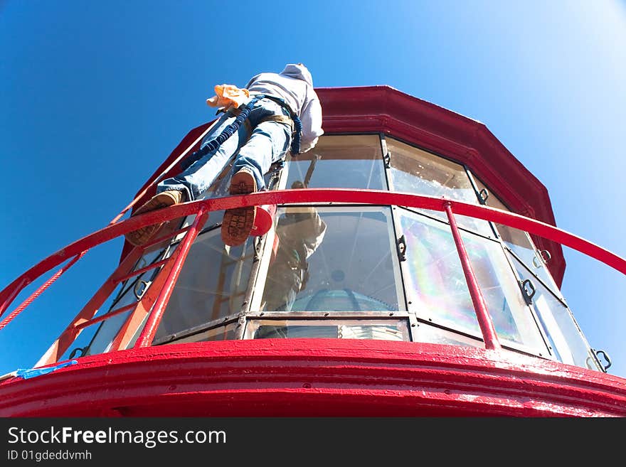 Man Painting Lighthouse