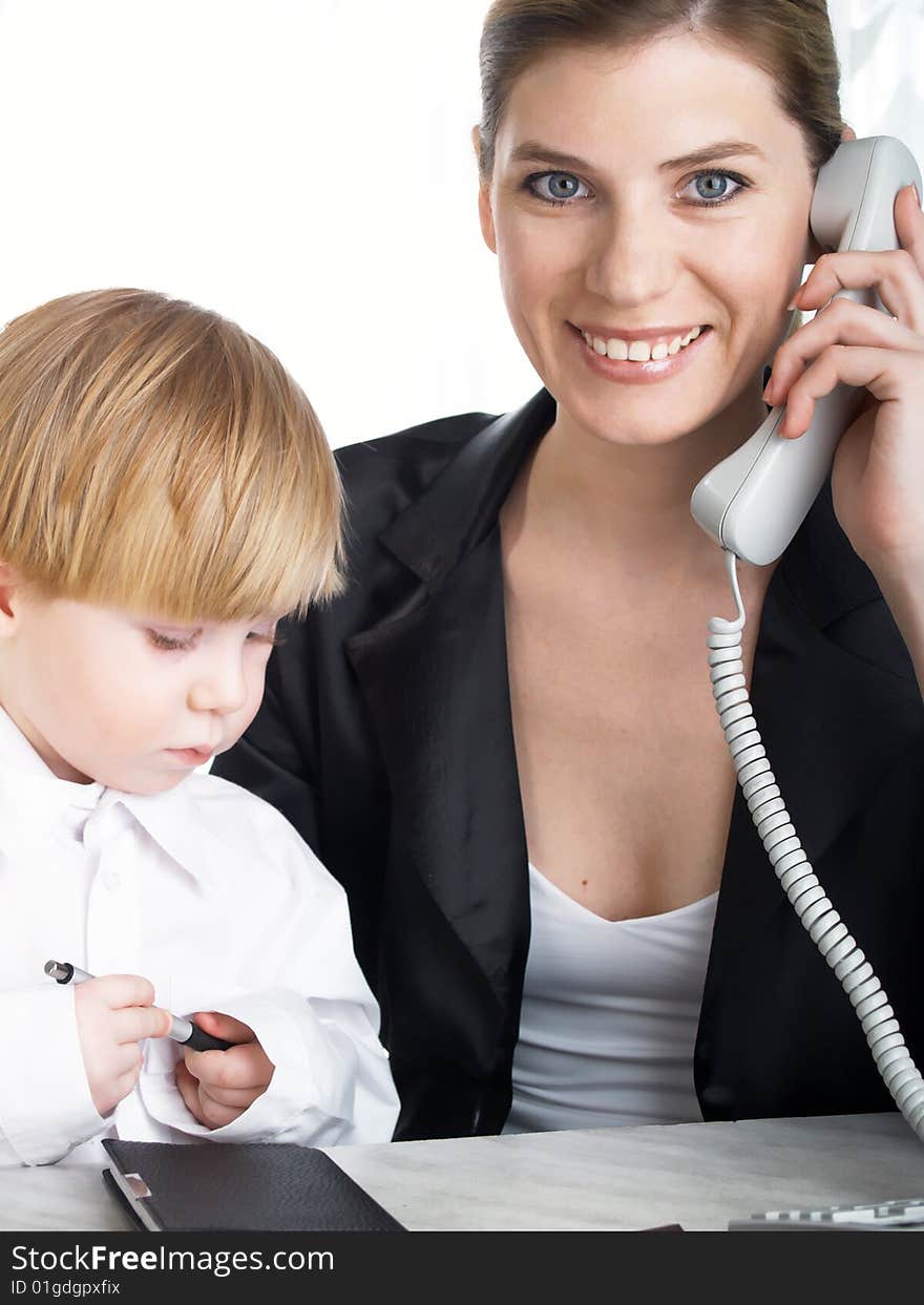 The beautiful businesswoman in a black jacket and boy. The beautiful businesswoman in a black jacket and boy