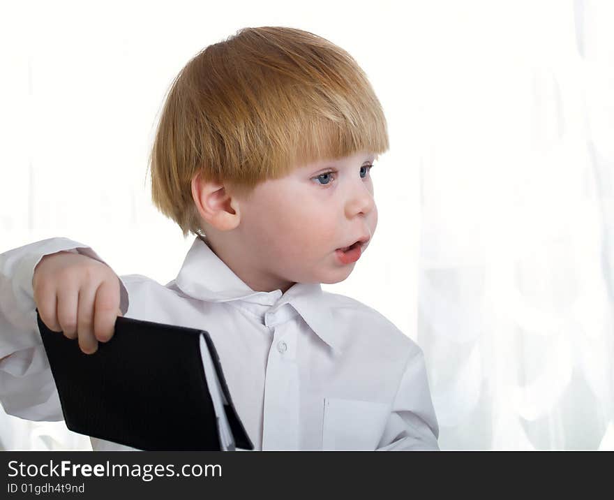 The beautiful little boy represents the businessman at office. The beautiful little boy represents the businessman at office