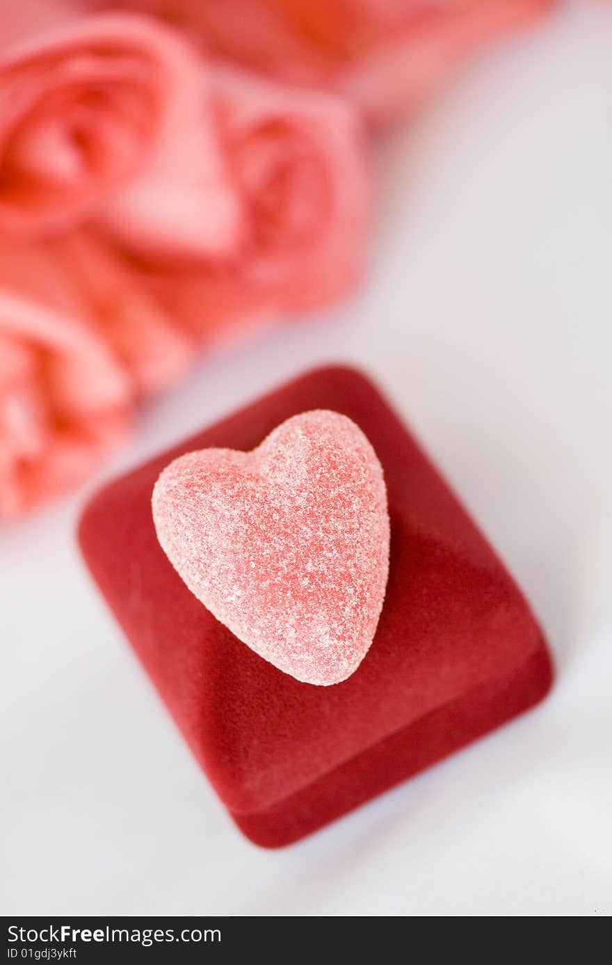 Sugar heart over gift box. Shallow depth of field.