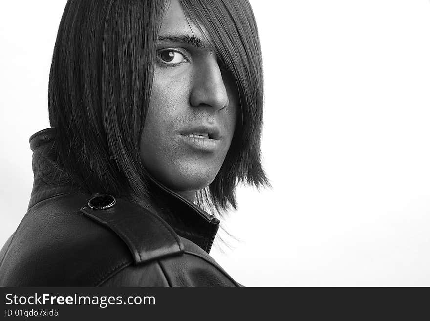 Young handsome man with long brunette hair on white background. Young handsome man with long brunette hair on white background