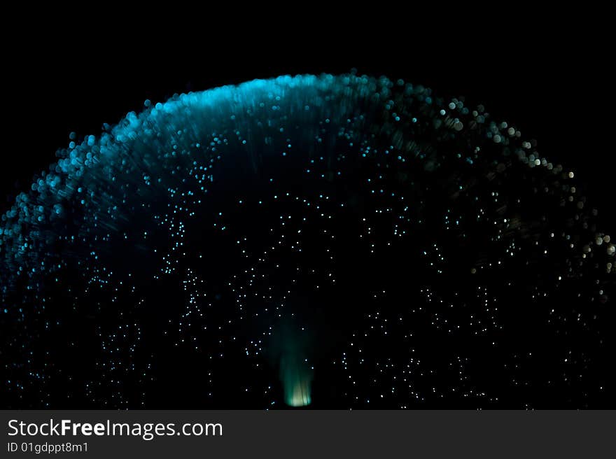 Blue colored top of a fiber glass lamp on a black background. Blue colored top of a fiber glass lamp on a black background