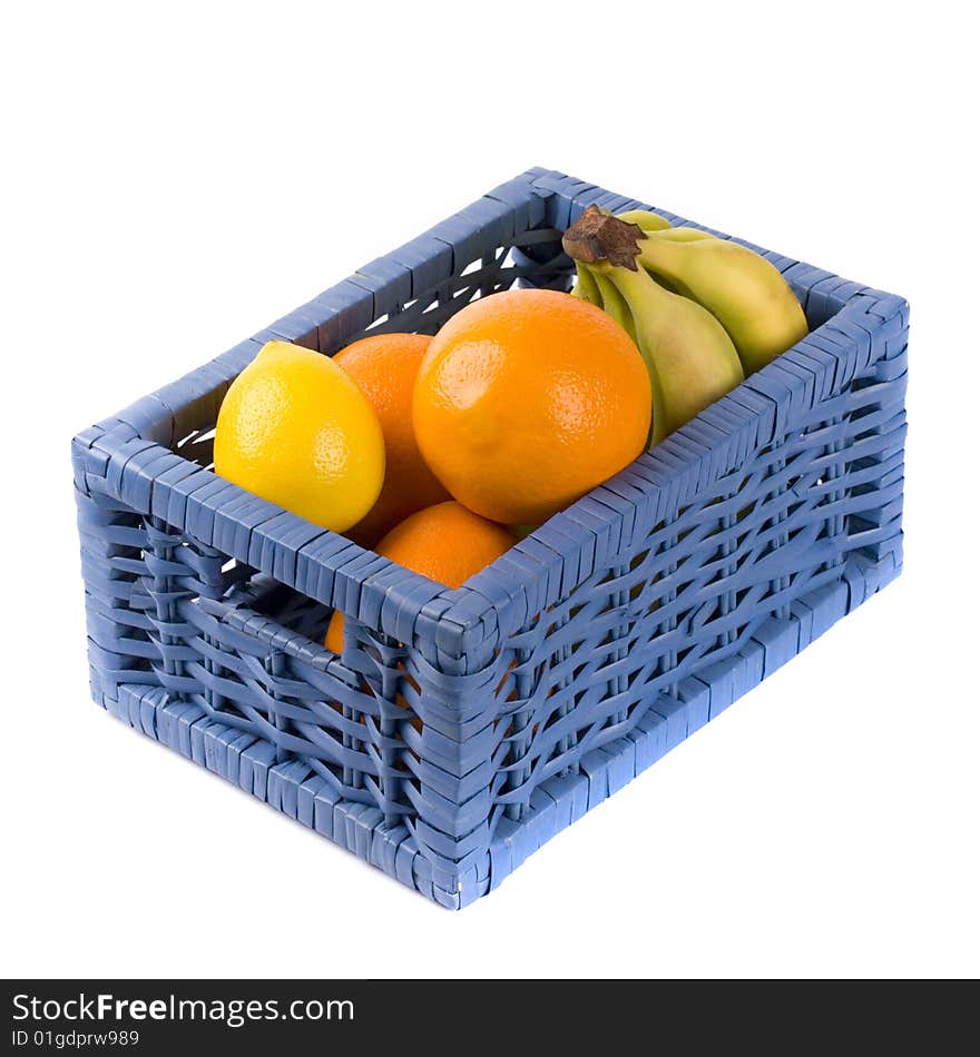 Blue basket with fruits on white background