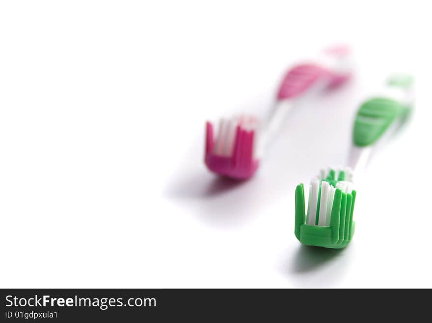 Two toothbrushes on white background